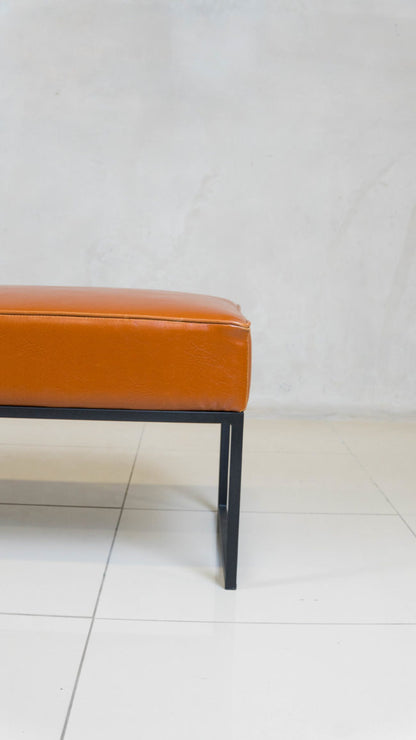 Steel Frame Ottoman with black epoxy base and upholstered top.