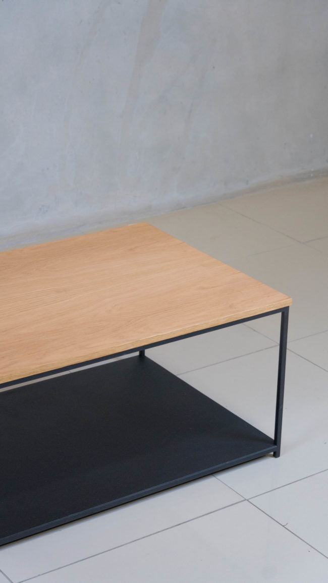 Black epoxy-coated steel frame coffee table, with dual levels.