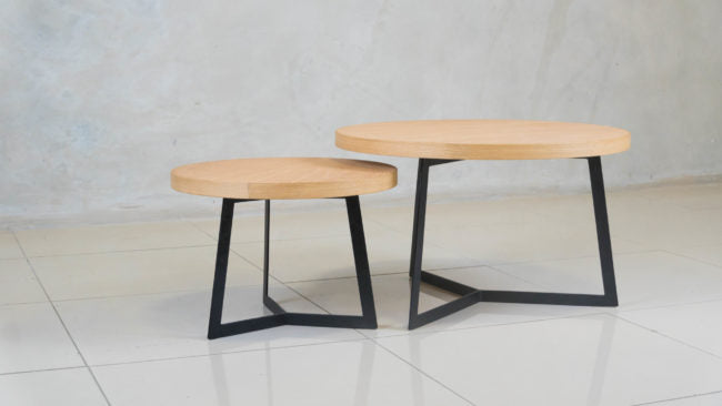 Eclipse nesting coffee table set with oak tops and black steel frames.