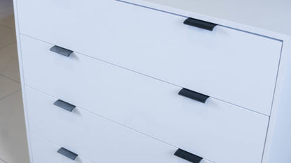 Sleek Chest of Drawers in white melamine with black handles.