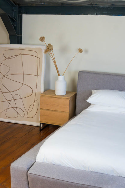 Customizable Bold Upholstered Bed with broad sides, offering luxury and comfort.