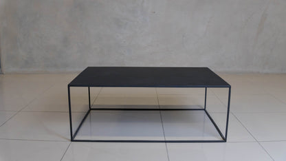 Corretto Steel Table featuring a minimalist design and epoxy-coated steel construction.
