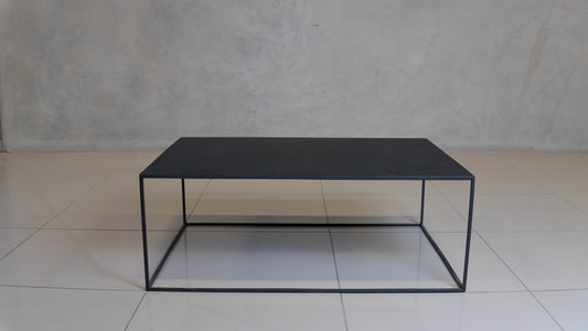 Corretto Steel Table featuring a minimalist design and epoxy-coated steel construction.
