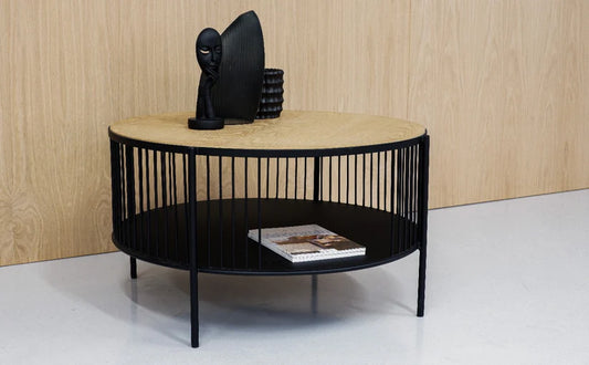 Large round designer coffee table, featuring second-tier black shelf.